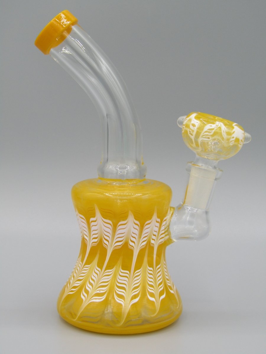 Right side view 6.5" raked glass, bent neck, bell shaped water bong in yellow.