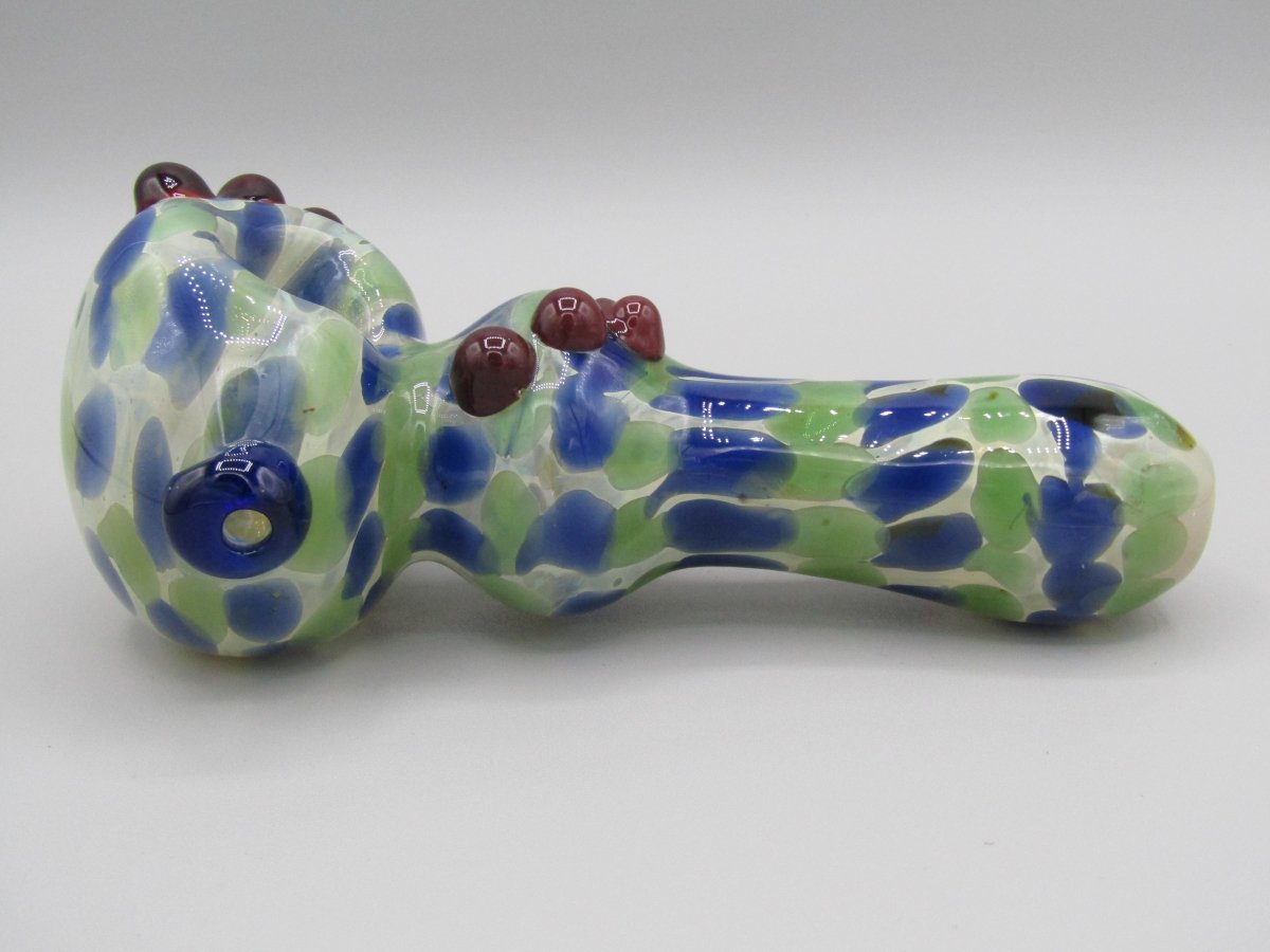 Left side view 6" double blown spoon hand pipe w/ multiple knockers...bubble trap and mixed fumed glass w/ blue/green/white color combo.