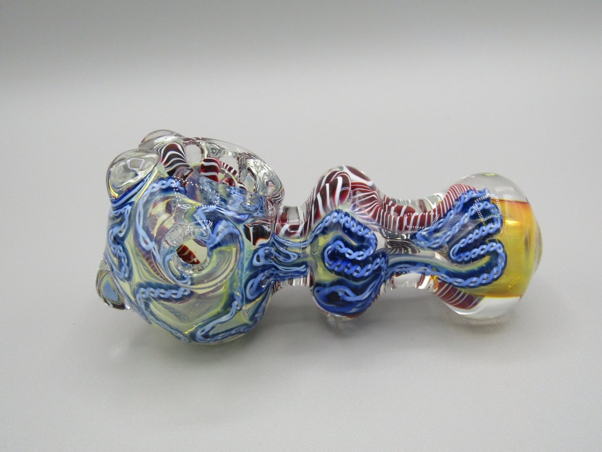 Left side view 4" triple blown, ringed, spoon hand pipe w/ multiple knockers...ribboned and gold fumed glass  w/ multi color accents.