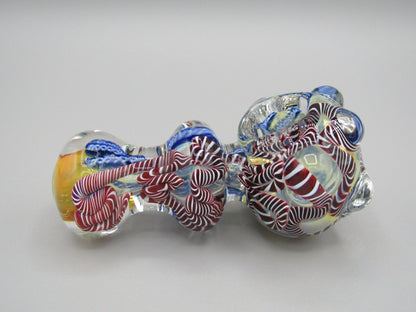 Right side view 4" triple blown, ringed, spoon hand pipe w/ multiple knockers...ribboned and gold fumed glass  w/ multi color accents.