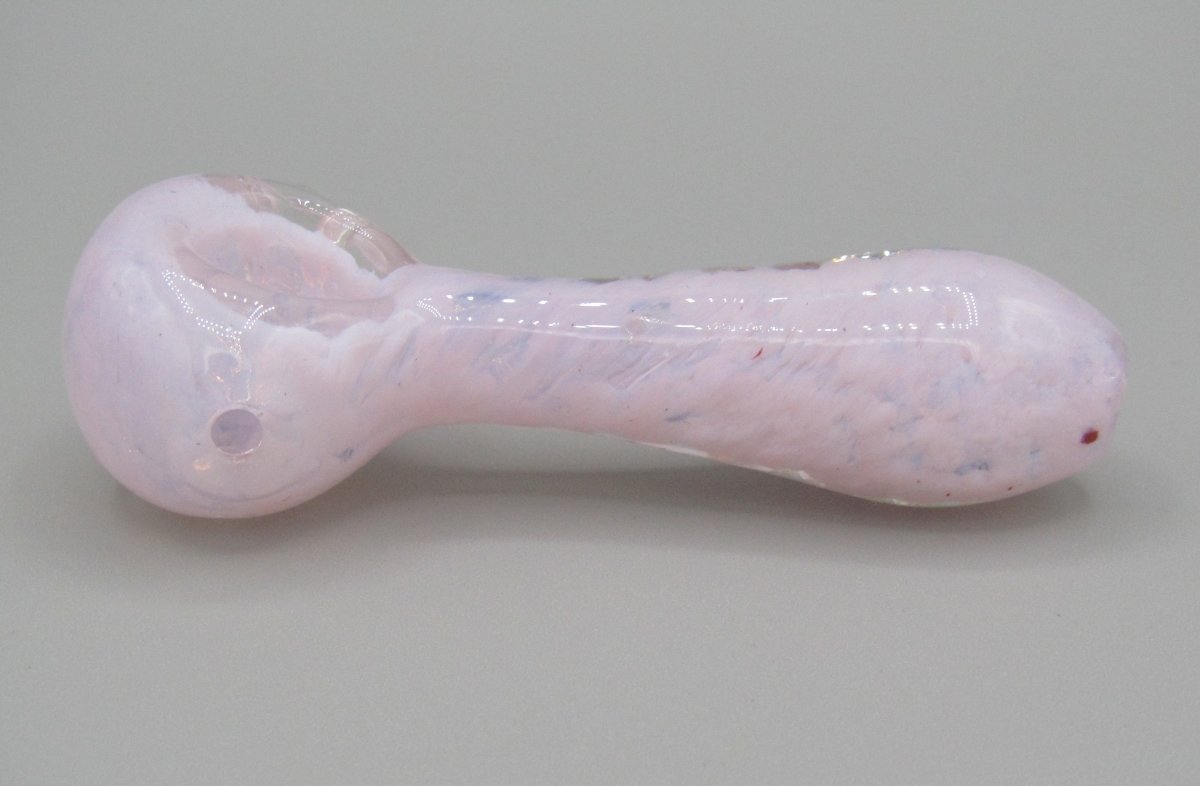 Left side view 4" fritted spoon hand pipe w/ knocker and milky pink color.