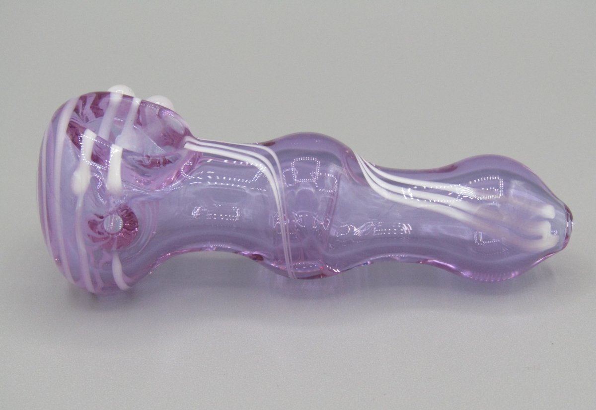 Left side view 3.5" swirl bulged spoon hand pipe w/ triple knockers and translucent purple color w/ white swirls.