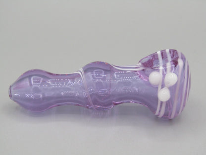 Right side view 3.5" swirl bulged spoon hand pipe w/ triple knockers and translucent purple color w/ white swirls.